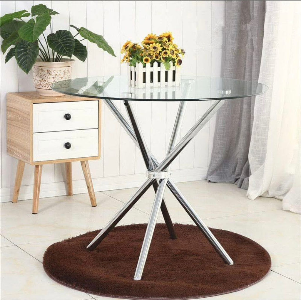 Prix : 18000f .                                Table de salle à manger ronde de luxe moderne en métal et verre et très solide.